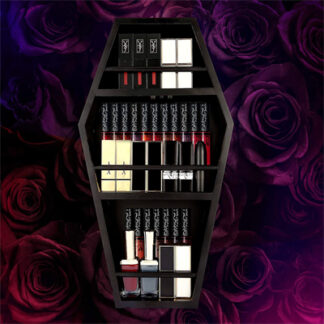 A makeup holder cabin in the shape of a coffin is displayed with makeup stuffed inside in rows and the background is velvety roses of purple and red tones.