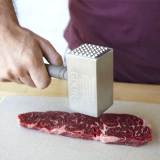 Thor's hammer Mjolnir from The Avengers movie franchise is in the shape of a meat tenderizer with beveled edges at two sides and a man is presented tenderizing a meat with it.