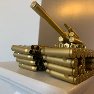 A tank sculpture made out of empty bullet casing shells is presented. With a brass paint finish applied it shines handsomely.