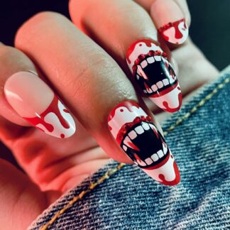Nails are done with vampire teeth and blood dripping from the tip of the nails.